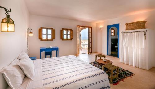 Postel nebo postele na pokoji v ubytování Tasguayan Maison de Charme
