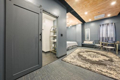 a room with a door leading to a bedroom at Indigo Pass Boutique Hotel in Middletown