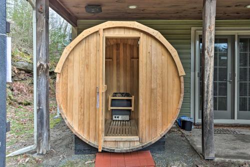 a large wooden hobbit house with a large wooden door at Large Yard and Games Edgewater Escape in Paupack! in Paupack