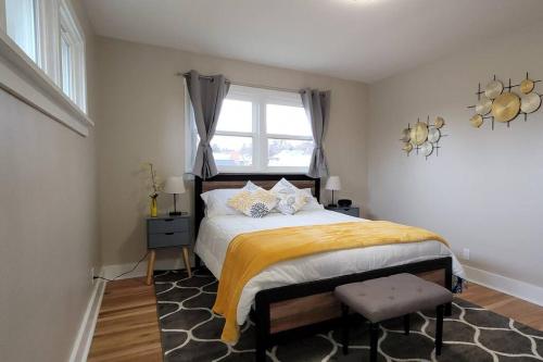 a bedroom with a large bed and a window at The Brickhouse in Pocatello