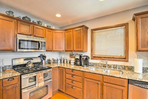 Una cocina o zona de cocina en Lakefront Roscommon Home with Game Room and Dock!