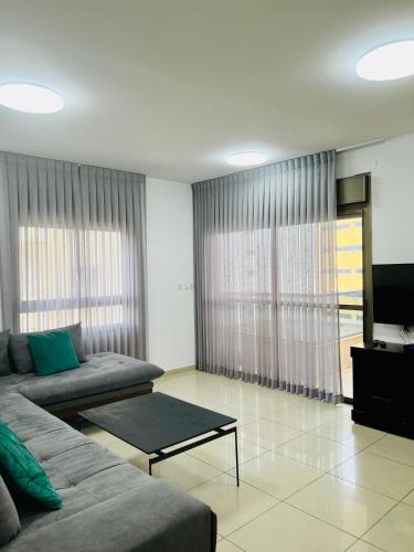TV a/nebo společenská místnost v ubytování King David Apartment