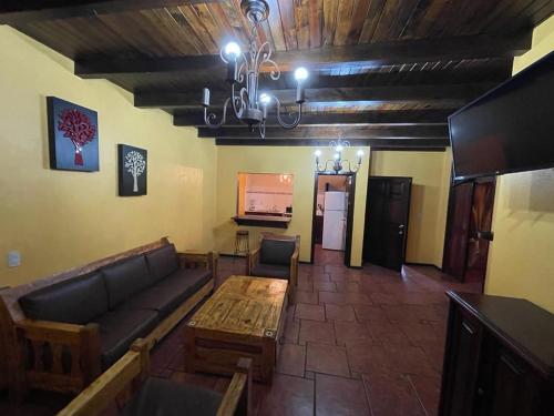 a living room with a couch and a table at Villas Lupita in Mazamitla
