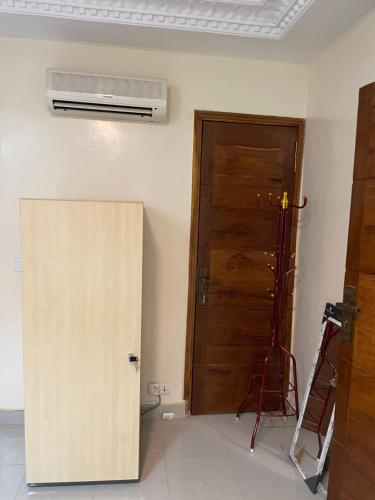 a room with a door and a air conditioner at GHEST HOUSE BASS in Dakar