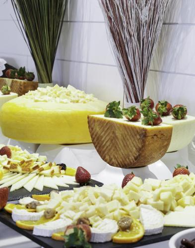 a bunch of food on a table with fruits and vegetables at H10 Playa Esmeralda - Adults Only in Costa Calma