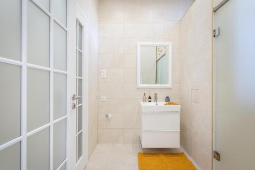 a bathroom with a sink and a shower at Budapest Eye Residence in Budapest