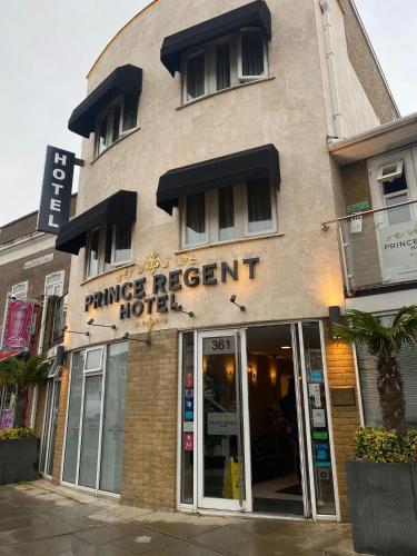 a tan building with a dance resort hotel at Prince Regent Hotel Excel London in London