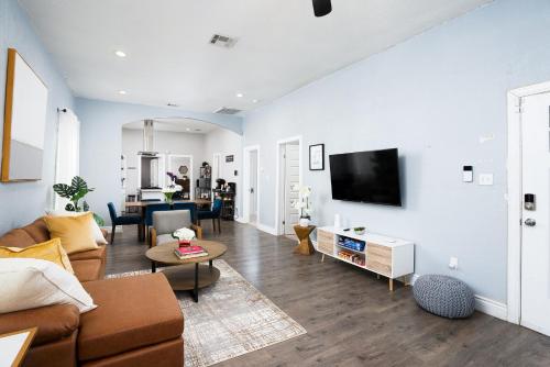 a living room with a couch and a tv at Modern 3 Bed, 2 Bath Home Minutes to Downtown & Alamodome in San Antonio