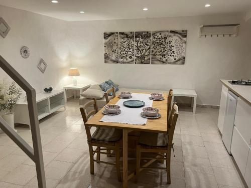 a kitchen and dining room with a table and chairs at Centrale56 in Bisceglie