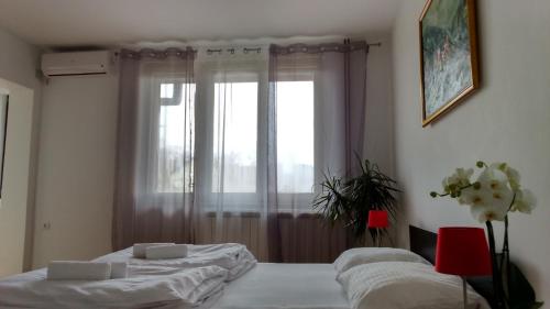 Una cama o camas en una habitación de Vrnjci House