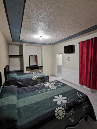 Ένα ή περισσότερα κρεβάτια σε δωμάτιο στο Hotel Antonio