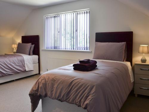 a bedroom with two beds and a large window at Lucys Lodge - Ukc2202 in Doddington