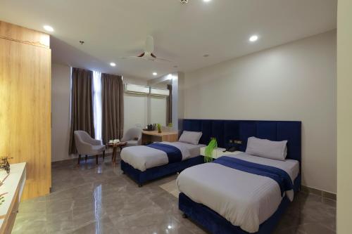 Katil atau katil-katil dalam bilik di Hotel Bay Laurel Retreat