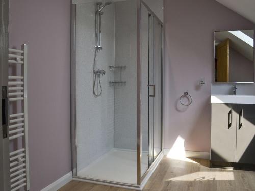 a glass shower in a bathroom with a sink at Aimmees Lodge - Ukc2203 in Doddington