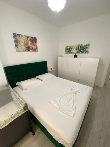 Postel nebo postele na pokoji v ubytování Hard Rock Apartments