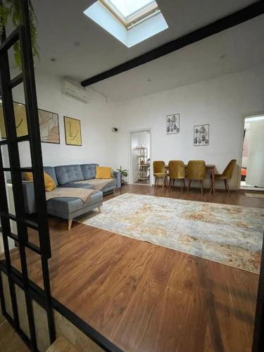 a living room with a couch and a table at Apartament la casa in Timişoara