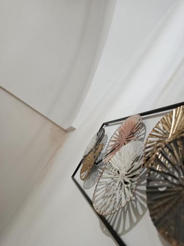 two umbrellas on display on a wall at A&K HOME in Ceglie Messapica