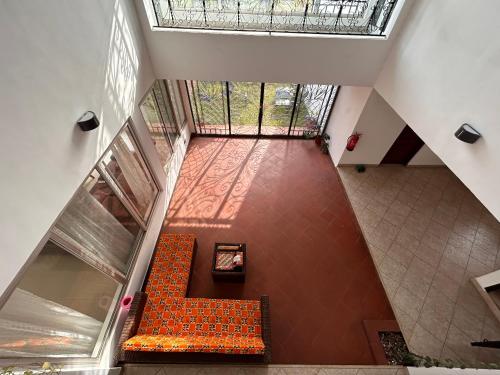 an overhead view of a staircase with a bench in a building at The Dzorwulu Castle - A Villa with private rooms in Accra
