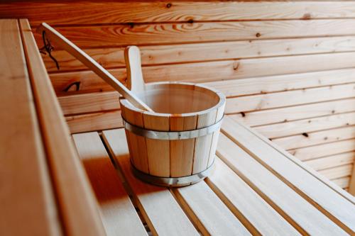 a bucket sitting on a table in a sauna at Rösslgut Bed & Breakfast in Zederhaus