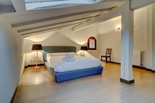 a bedroom with a bed with two towels on it at Villa Oasis by SanSe Holidays in San Sebastián