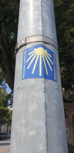 a pole with a blue and yellow sticker on it at Kovářská vyhlídka in Kovářská