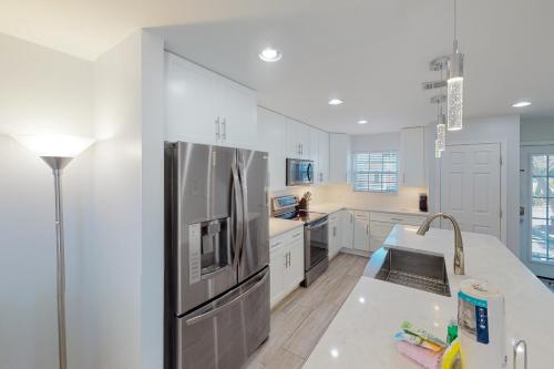 a large kitchen with a stainless steel refrigerator at Summer Lake Townhomes 1 in Destin