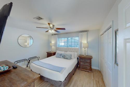 a bedroom with a bed and a ceiling fan at Summer Lake Townhomes 1 in Destin