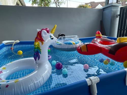 a childs pool with an inflatablevisorangering at 15Px 5BR V Jaccuzi Spa n KTV n Pool Table At Georgetown, USM n Lam Wah Ee Hospital -Kids pool no more in Gelugor