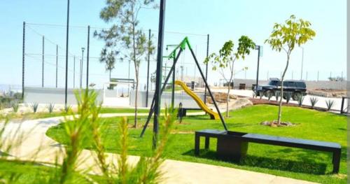 a park with a playground with a slide at Torres casillas in Tonalá