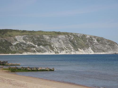 a group of people standing on the beach at Castle View Annex in Wareham