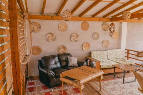 a living room with a couch and a table at Villa Eden Palomino in Palomino