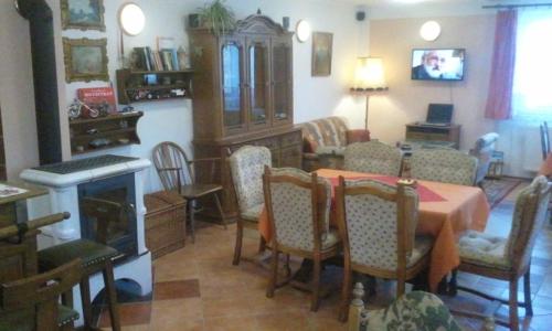 a living room with a table and chairs and a dining room at Chalupa, 3x apartmány, 11 lůžek. in Sedlec