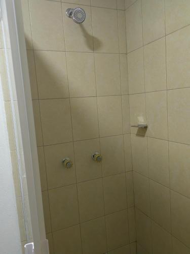 a bathroom with a shower with a glass door at Posada villa aurora in Bernal