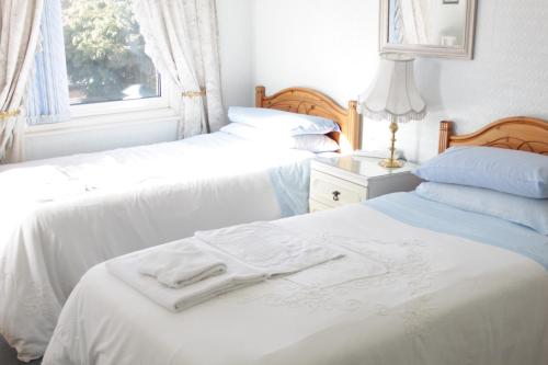 Ένα ή περισσότερα κρεβάτια σε δωμάτιο στο Tanamara Guest House