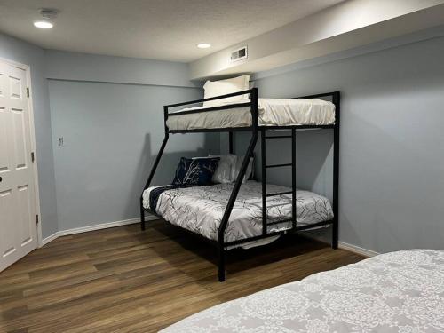 a bedroom with two bunk beds in a room at Cozy Home for Family & Friends Gathering in Beaverton
