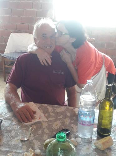 a man and a woman sitting at a table at Agriturismo La Collina Verde in Levanto