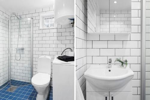 a white bathroom with a sink and a toilet at Cute little cottage in Höllviken in Höllviken