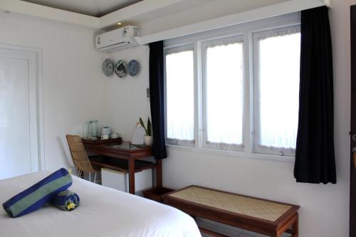 Postel nebo postele na pokoji v ubytování Lotus Bungalows