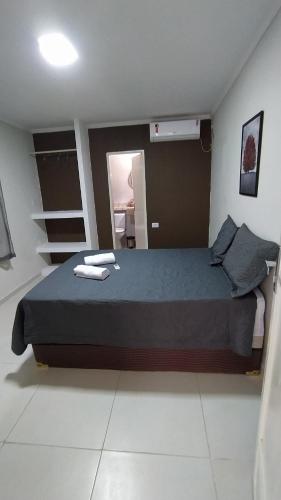 Ένα ή περισσότερα κρεβάτια σε δωμάτιο στο Casa Temporada Waldemar Damasceno - Beira Rio com piscina