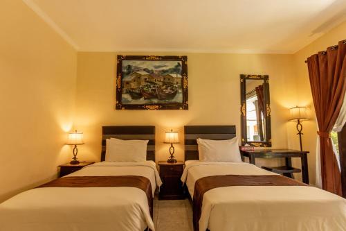 Tempat tidur dalam kamar di Semaya One Beach Hotel
