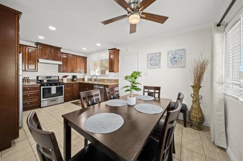 a kitchen with a dining room table and chairs at Dreamy & Relaxing Gem 12mins to DT LA in Alhambra