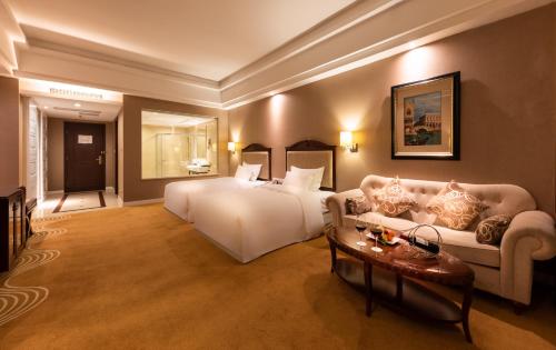 Ένα ή περισσότερα κρεβάτια σε δωμάτιο στο Country Garden Phoenix Hotels Shenyang Yuhong