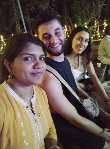 a man and two women posing for a picture at Mundro Garden Homestay in Munroe Island