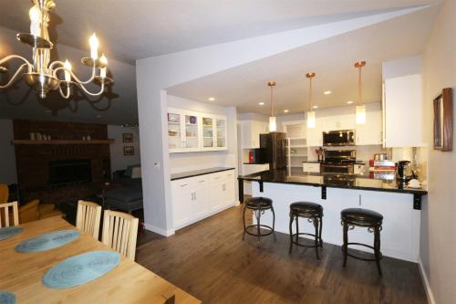 a kitchen and dining room with a table and chairs at PA Sea View Deck House in Port Angeles