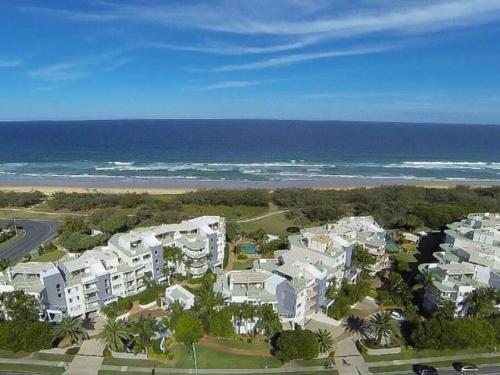 an aerial view of a resort near the ocean at Kawana Waters Ocean Front Unit-Surfside Resort Sunshine Coast in Buddina