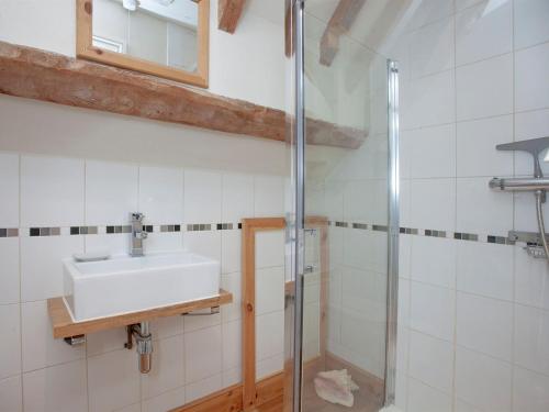 a bathroom with a sink and a shower at The Old Forge in Bleadon