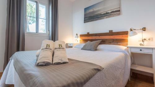 a bedroom with a bed with two pillows on it at Casa Ronda Vélez-Málaga by Ruralidays in Vélez-Málaga