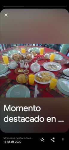 a table topped with plates of food and drinks at B&B KeisyAlba Punta Rucia in Punta Rucia