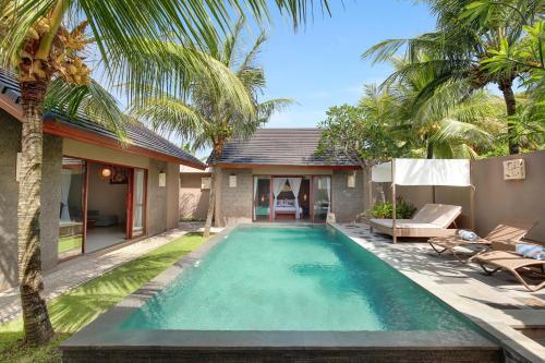 a swimming pool in the backyard of a villa at Lumbini Luxury Villas and Spa in Jimbaran