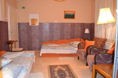 Una cama o camas en una habitación de Vár-lak Vendégház
